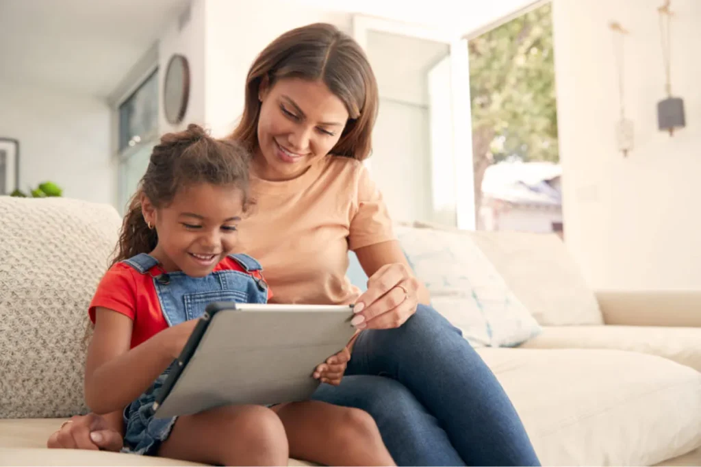 Parent and student sitting on sofa