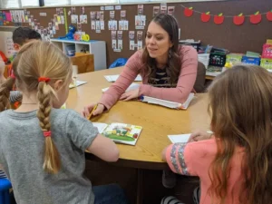 Elementary teacher working with small group of students