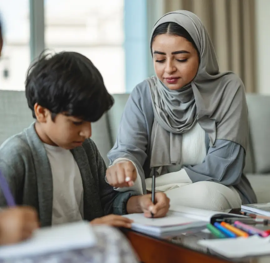 Mother Helping Her Son With School Work