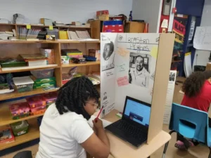 Elementary student doing research for a project